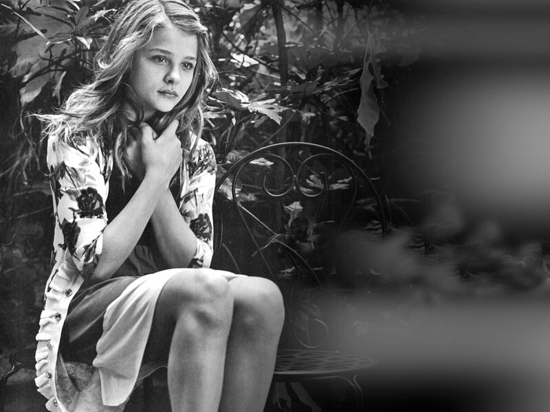 girl sitting on a garden chair
