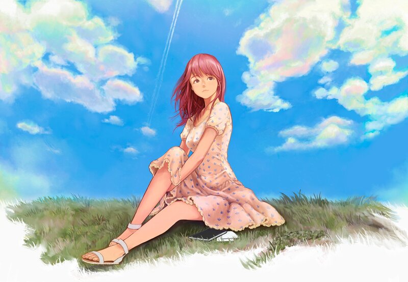 Girl sitting on a grassy hill