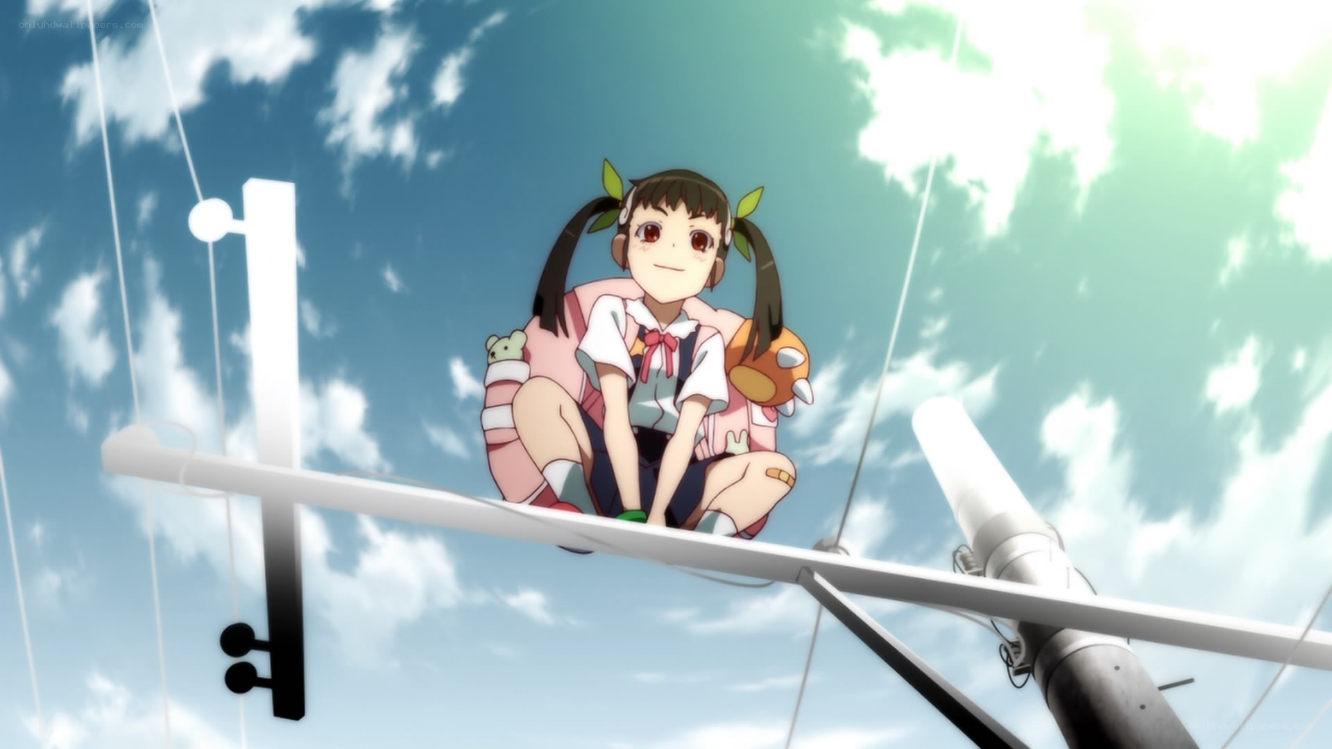 girl sitting on a pole