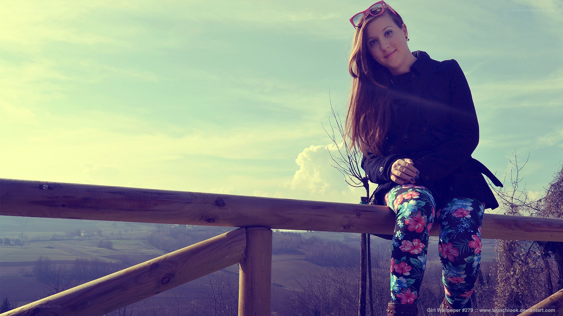 girl sitting on a railing