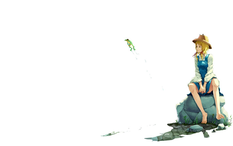 girl sitting on a rock with a frog