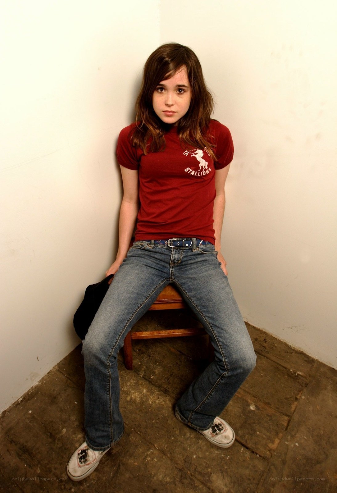 girl sitting on a stool