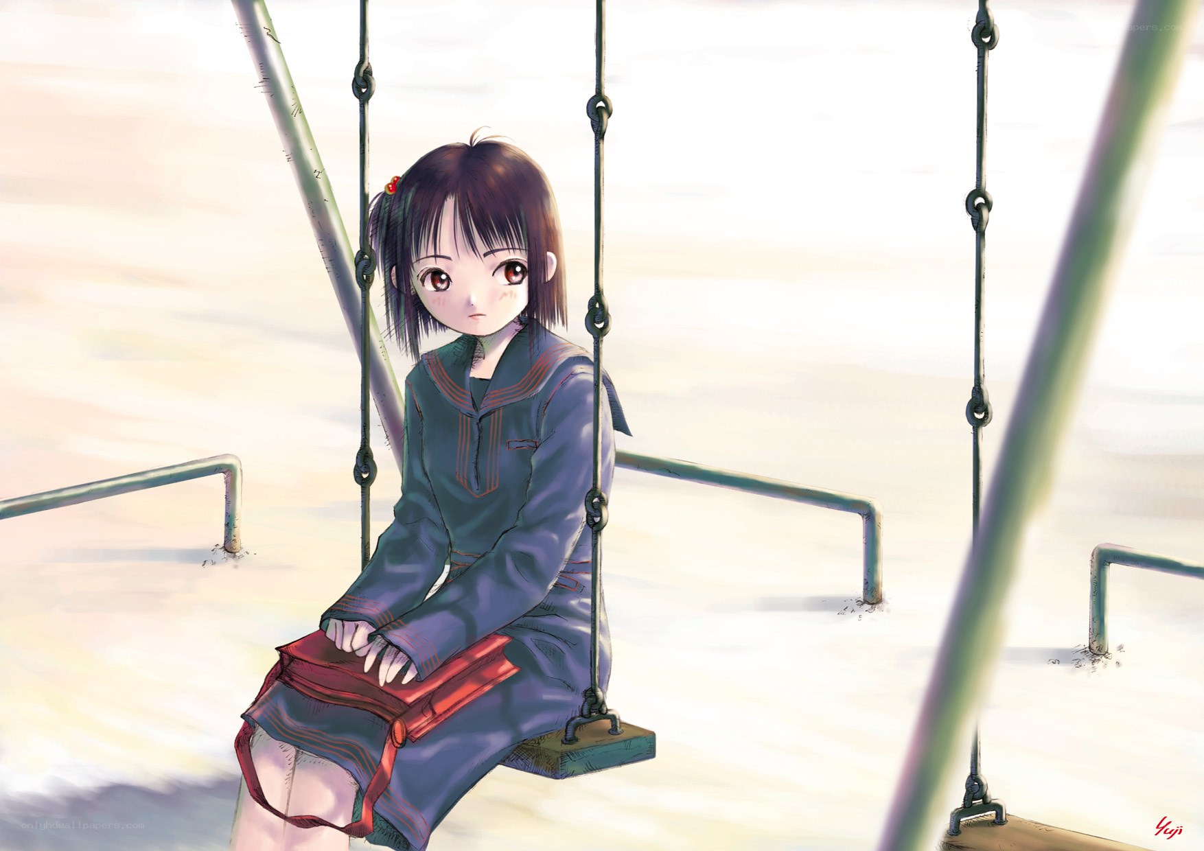 Girl sitting on a swing