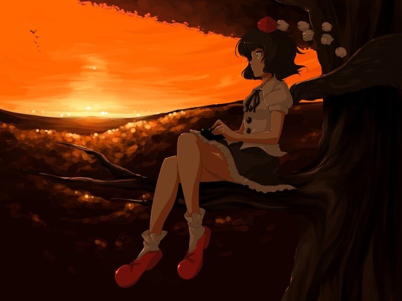Girl sitting on a tree branch