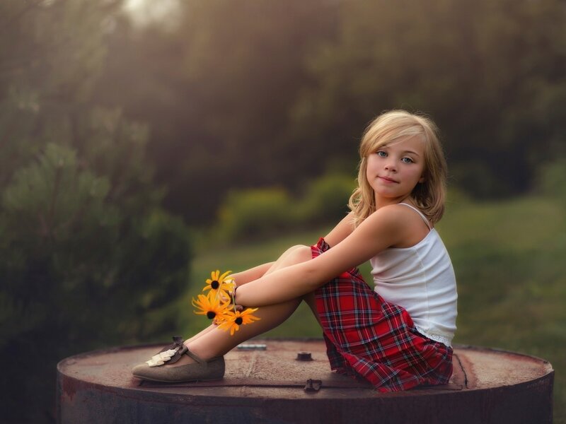 Girl Sitting on Barrel