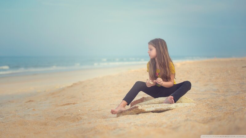 Girl Sitting on Beach — Beige