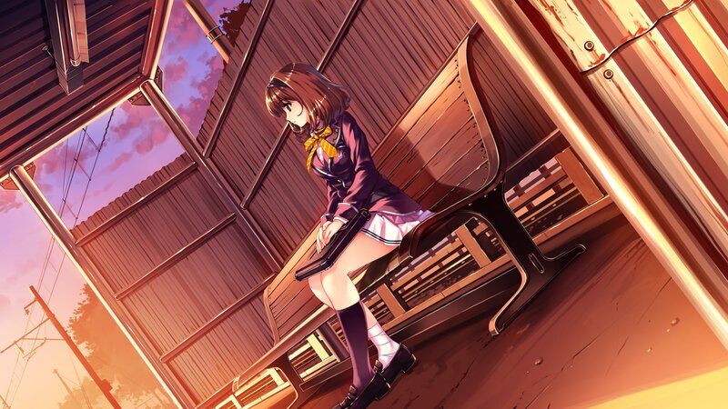 girl sitting on bench at sunset