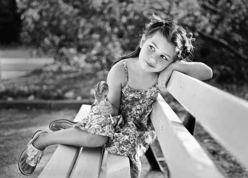 Girl Sitting on Bench — Black