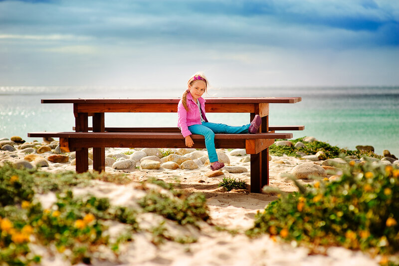Girl Sitting on Bench — Blue, Serene, Afternoon