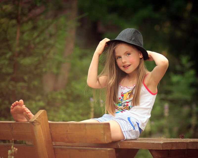 Girl Sitting on Bench — Green, Relaxed