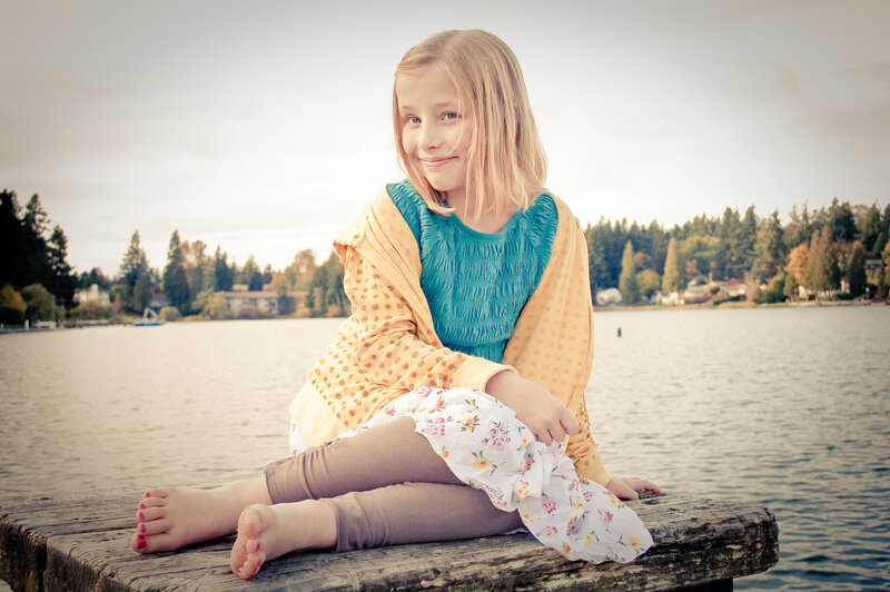 Girl Sitting on Dock — Blue