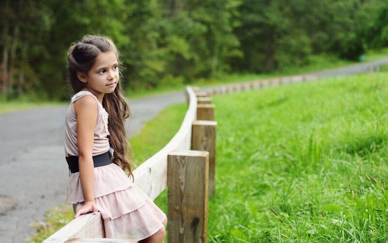 Girl Sitting on Fence — Green