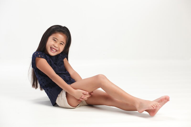 Girl Sitting on Floor — White, Happy
