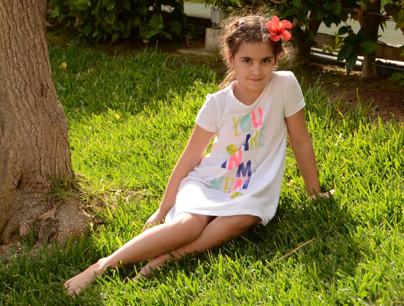 Girl Sitting on Grass — Green, Calm