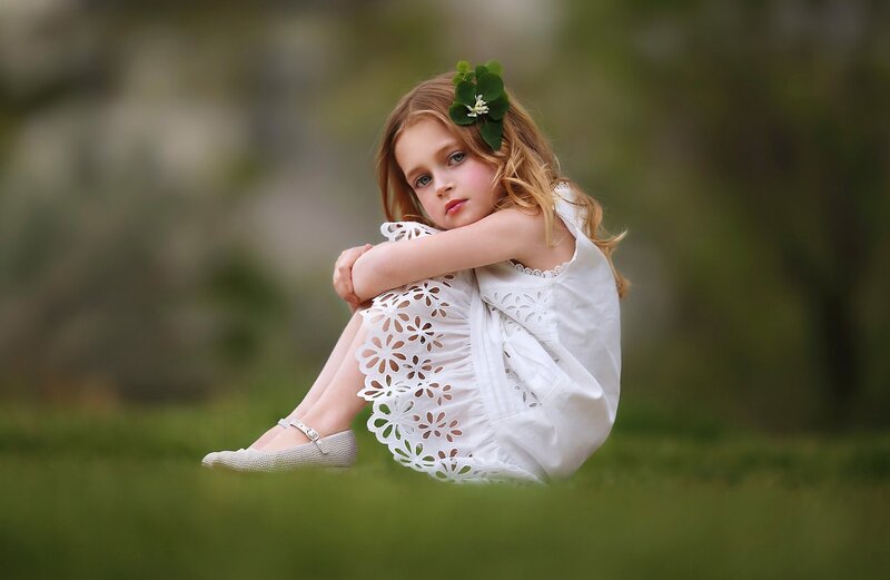 Girl Sitting on Grass — White
