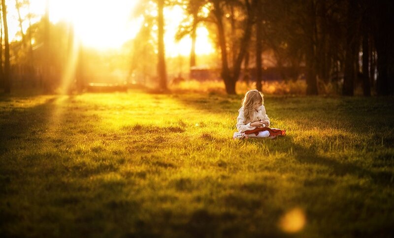 Girl Sitting on Grass — Yellow