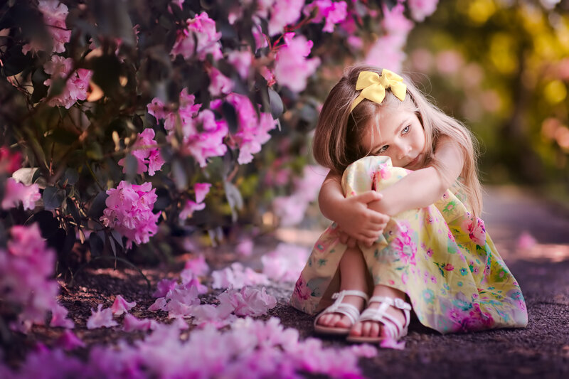 Girl Sitting on Ground — Pink
