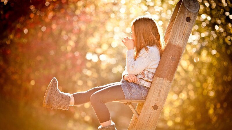 Girl Sitting on Ladder
