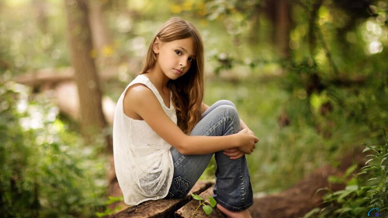 Girl Sitting on Log — Green, Serene