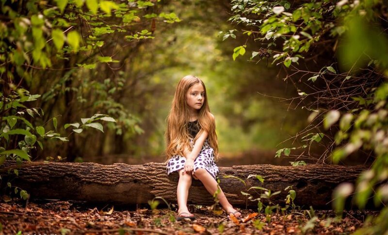 Girl Sitting on Log — Green