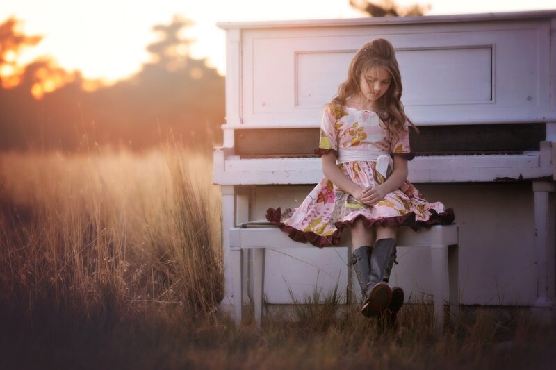 Girl Sitting on Piano — Pink