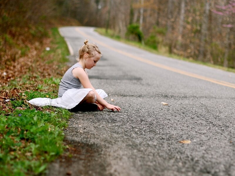 Girl Sitting on Road — Gray, Calm