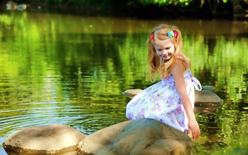 Girl Sitting on Rock — Green, Serene