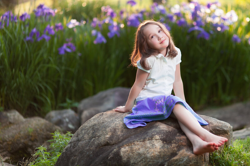 Girl Sitting on Rock — Purple