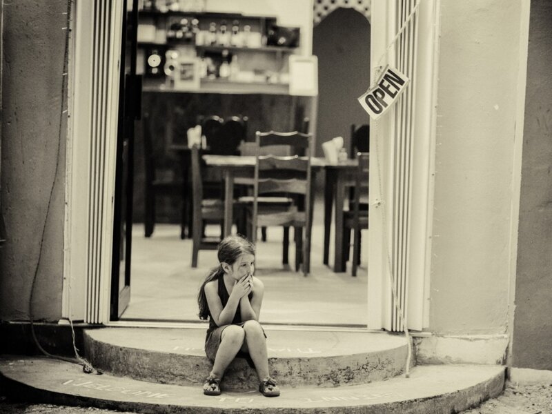 Girl Sitting on Step — Black