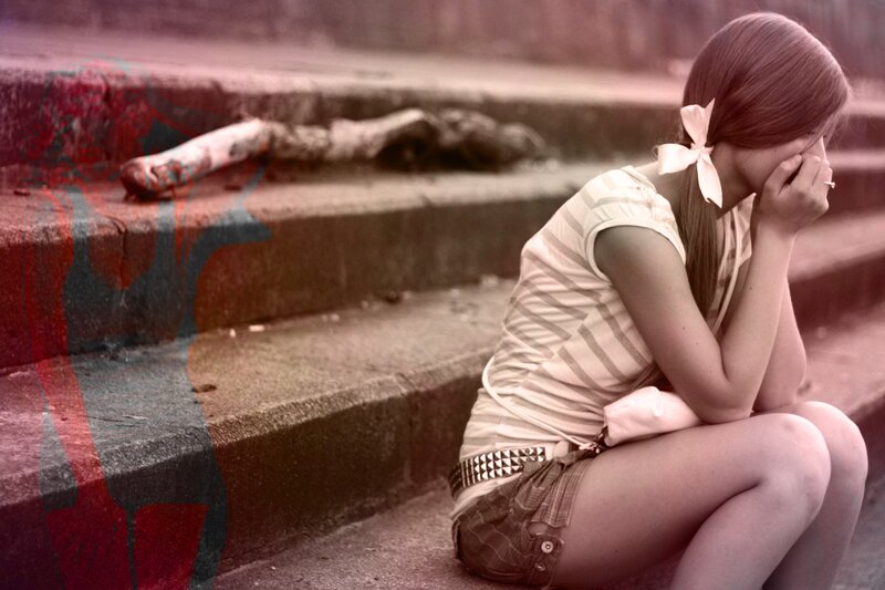 girl sitting on steps in distress