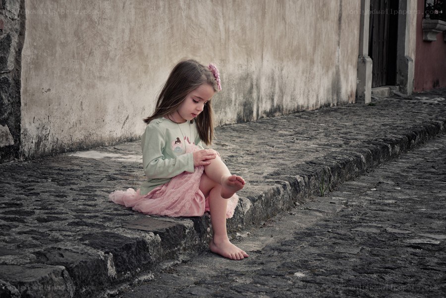 girl sitting on stone steps