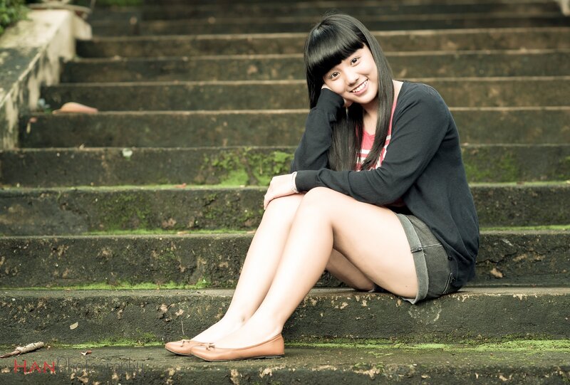 Girl sitting on stone steps