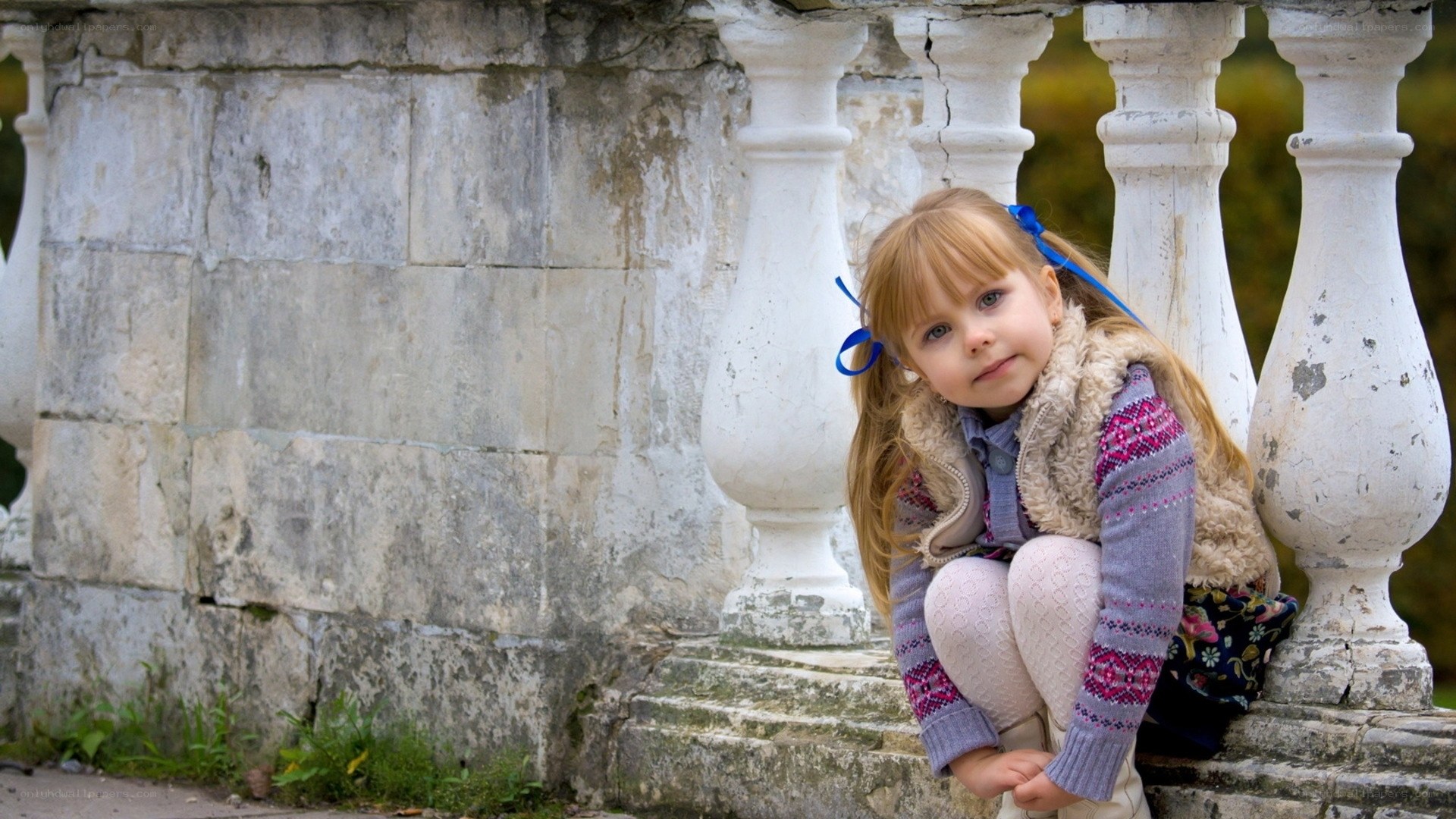 Girl sitting on stone steps
