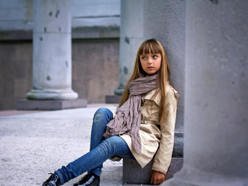Girl Sitting on Stone
