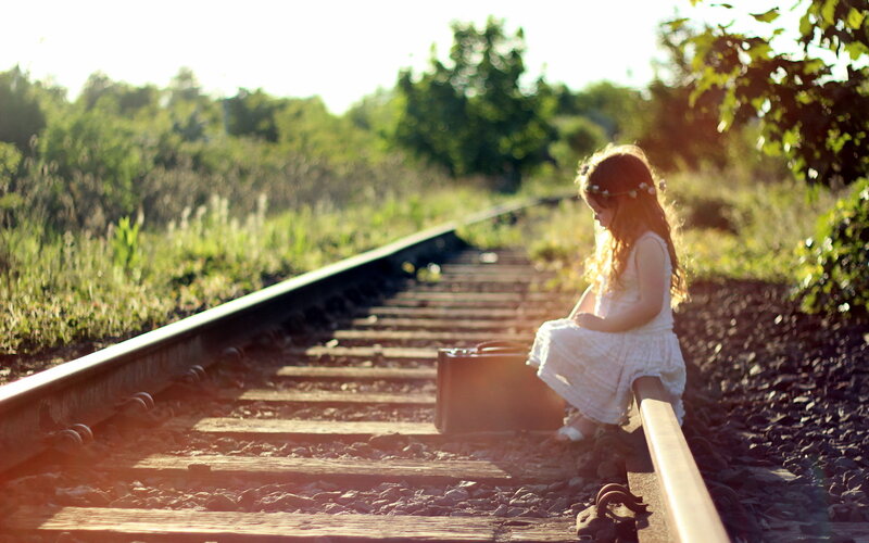 Girl Sitting on Train Tracks — Green