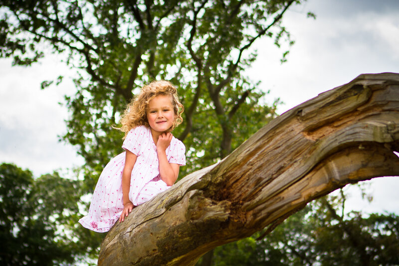 Girl Sitting on Tree Branch — Green
