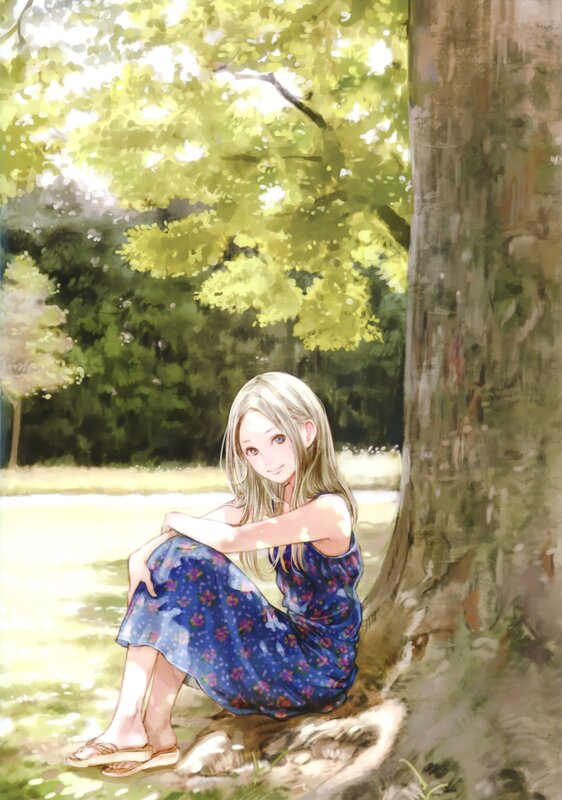Girl sitting under a tree