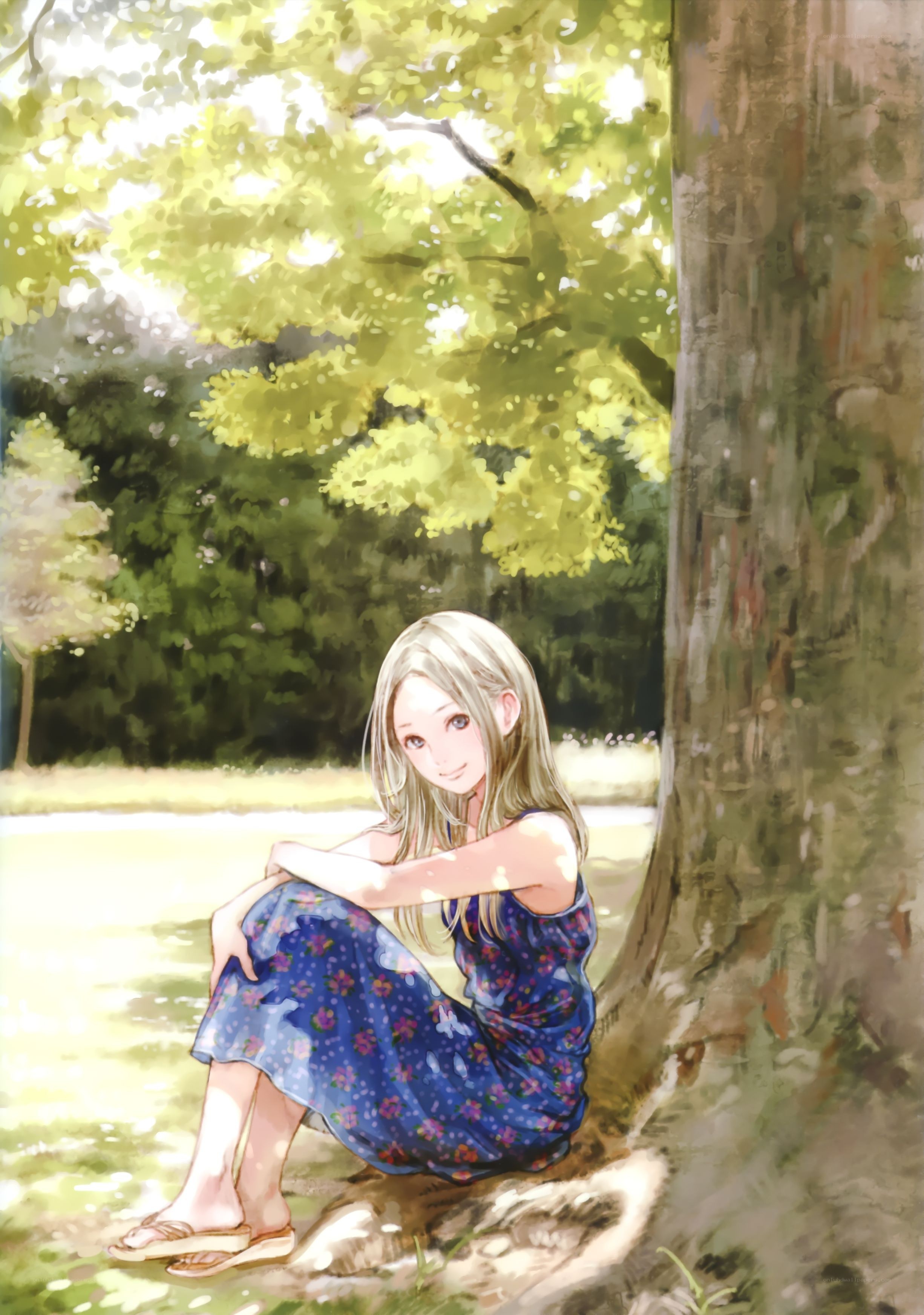 Girl sitting under a tree