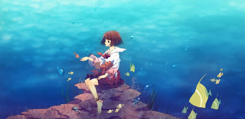 girl sitting underwater with fish