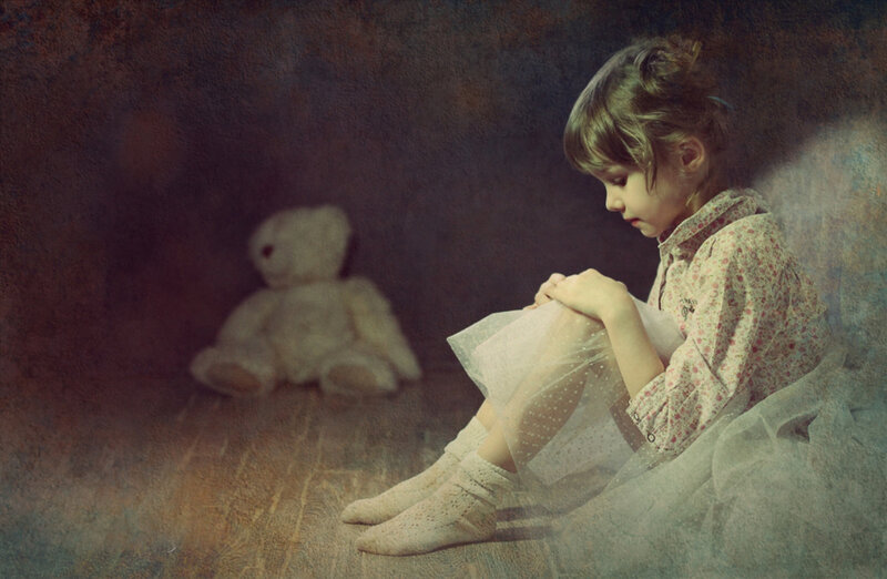 Girl Sitting with Teddy Bear