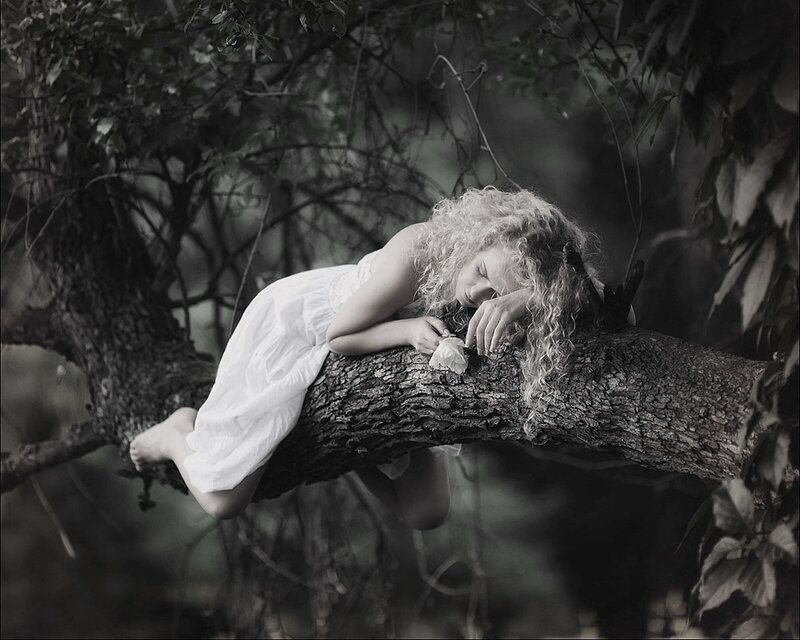 Girl Sleeping on Tree Branch