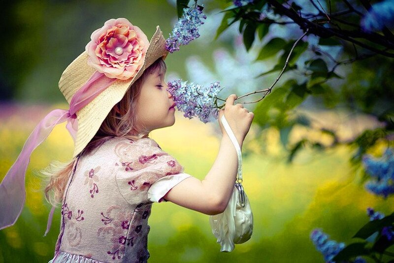 Girl Smelling Lilac