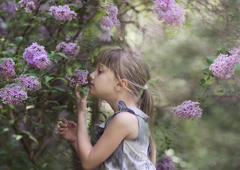 Girl Smelling Lilacs — Purple