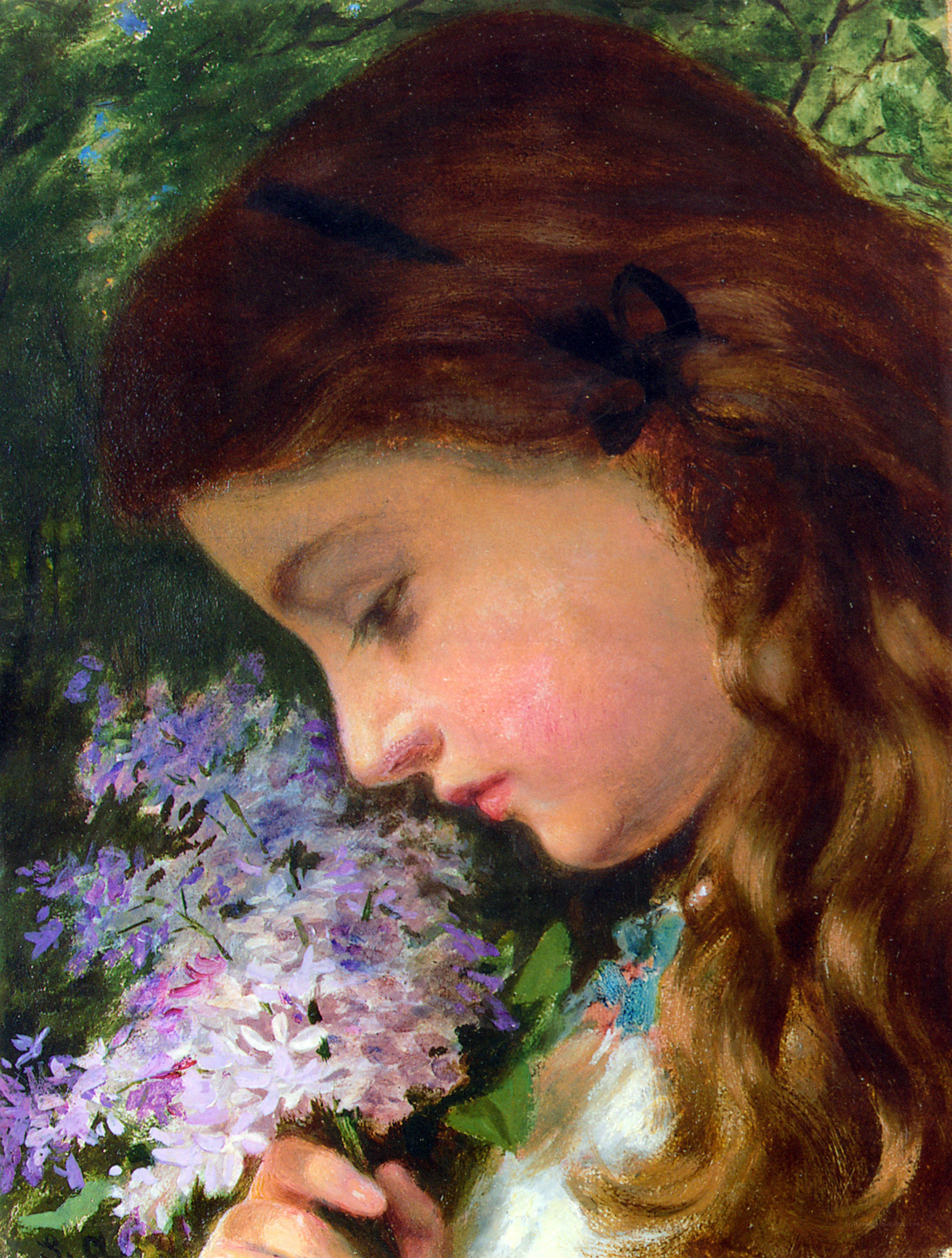 girl smelling lilacs