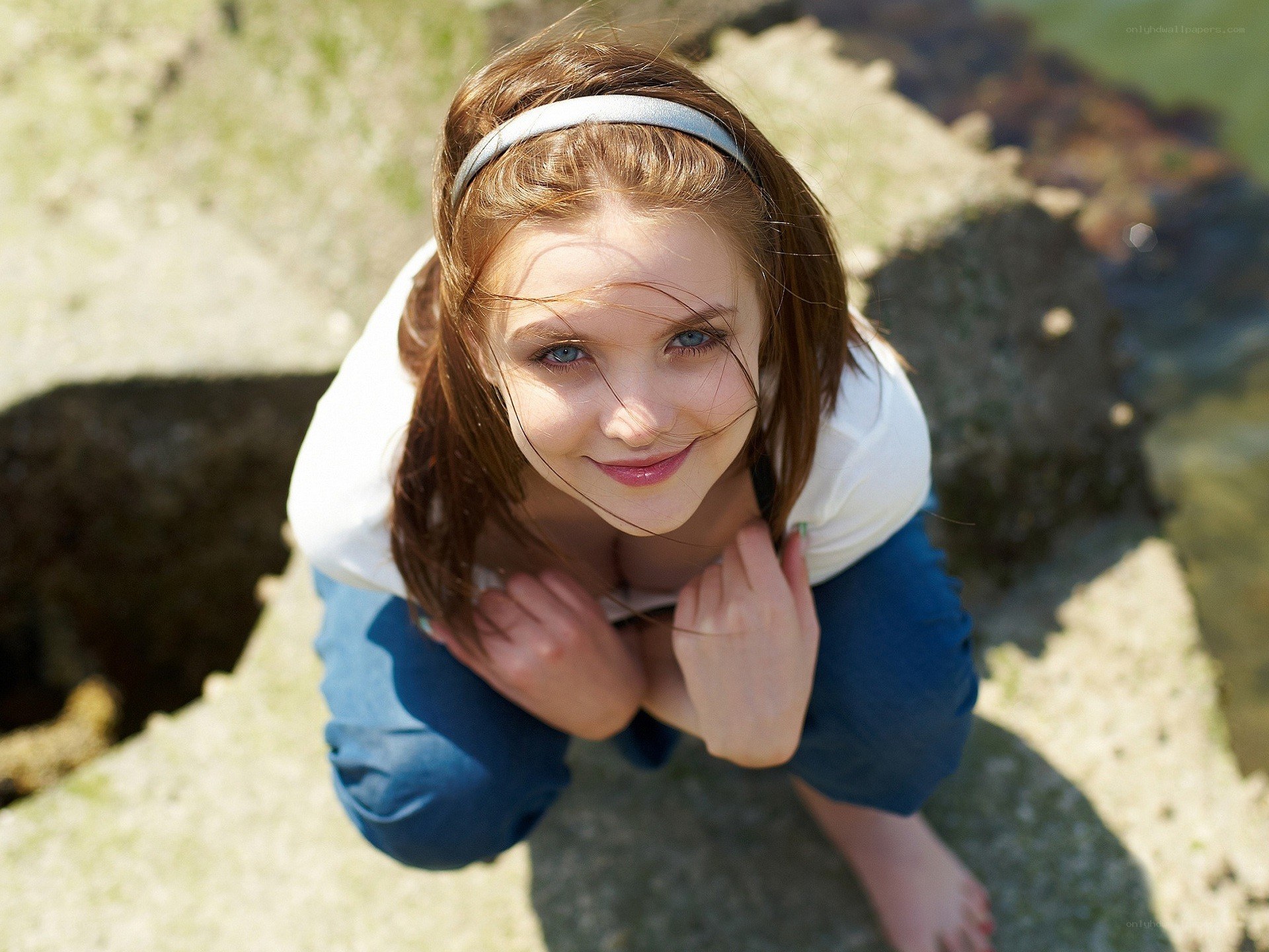 girl smiling on rocks