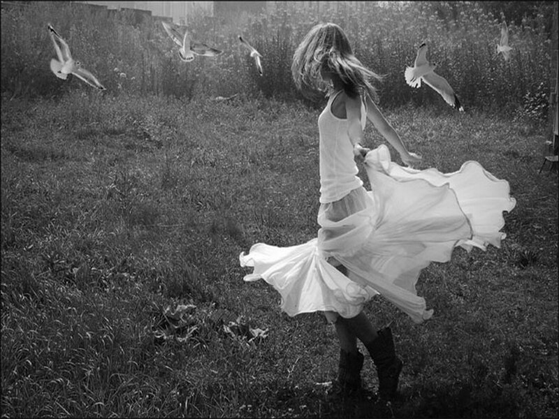 Girl spinning in a field