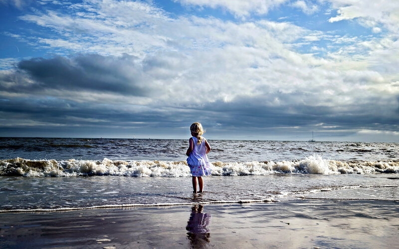Girl Standing on Beach