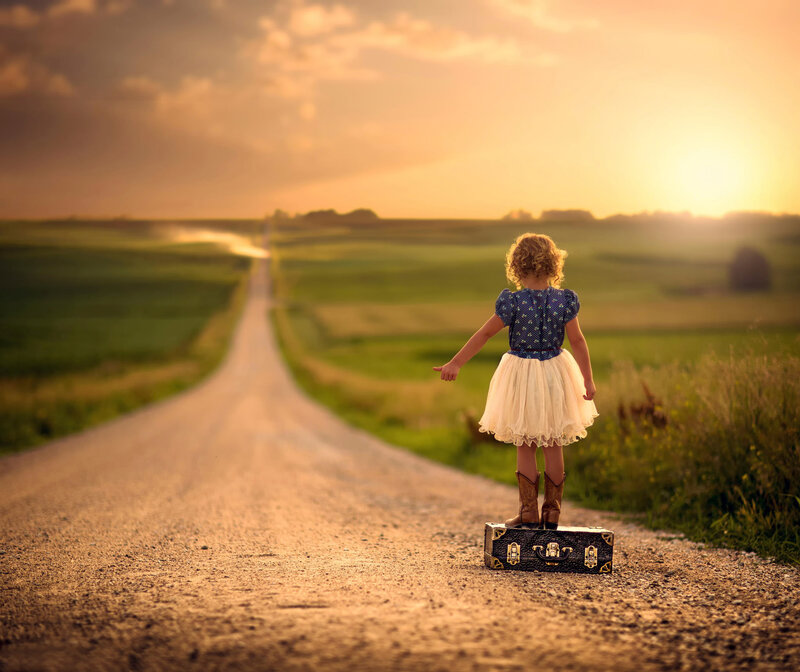 Girl Standing on Suitcase