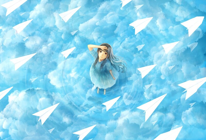 girl surrounded by paper airplanes