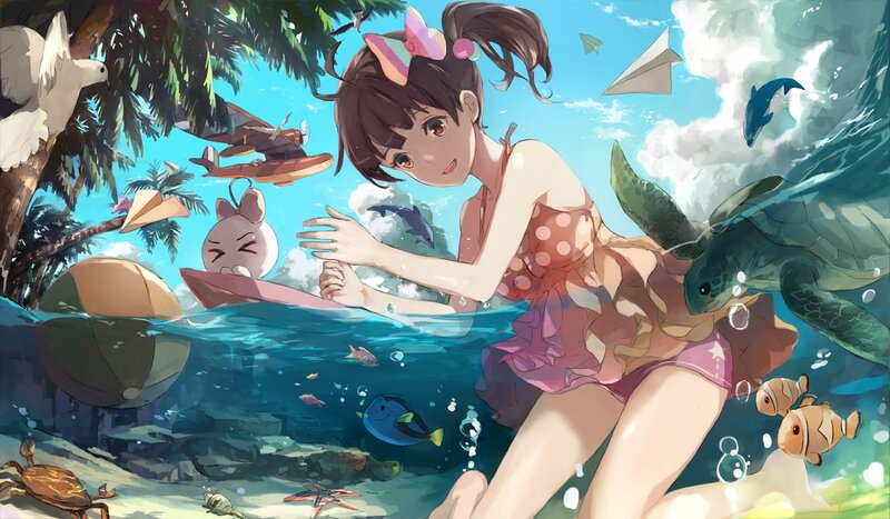 Girl swimming with sea creatures